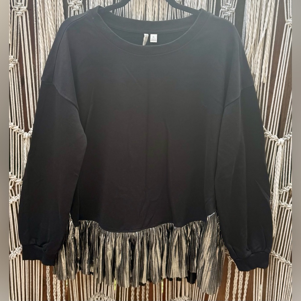 Cato women’s Black Sweatshirt with silver Ruffled Hem. Never worn. Size XL